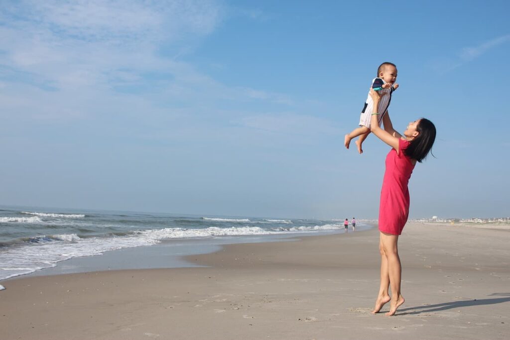 Mother and daughter in a beach 1