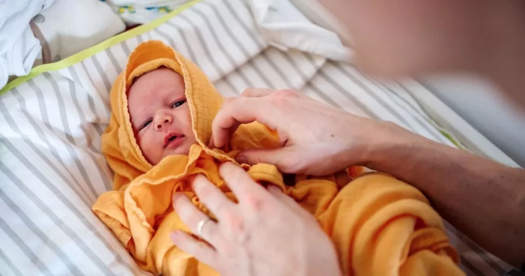 Essential Newborn Bathing Tips For Parents 5 A Father Drying a Newborn Baby with a Towel after Bath at Home